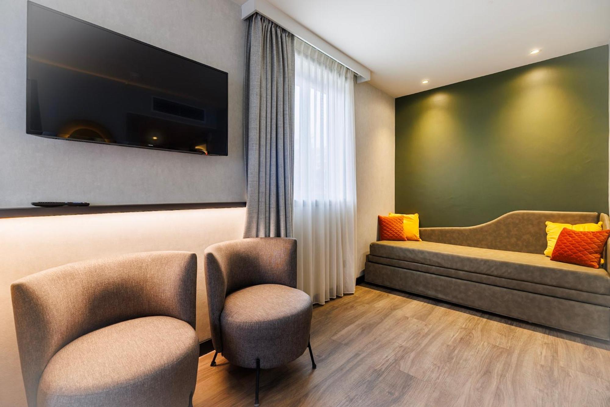 Quadruple Room One Double Bed Two Single Beds or Sofa Bed